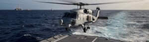 HMAS Perth's embarked MH60 Romeo helicopter prepares to conduct an air patrol